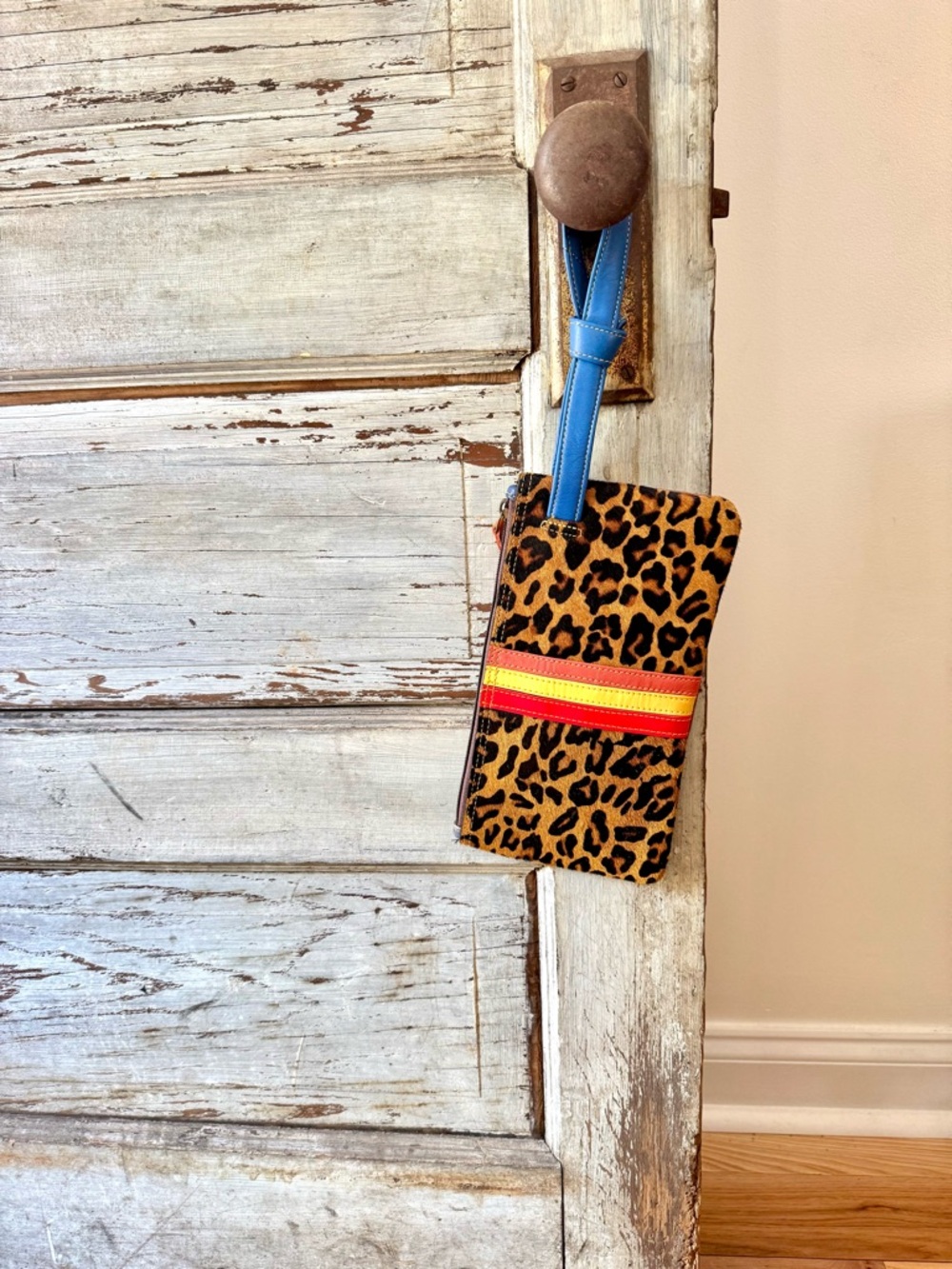 Leopard Print Wristlet Clutch with Blue Strap and Red-Yellow Accent